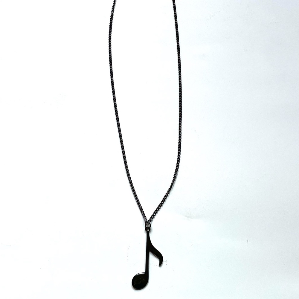 Long necklace with music note pendant